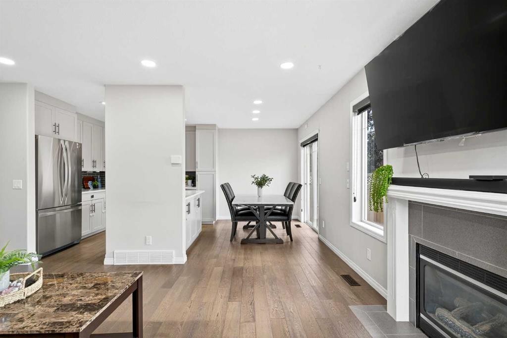 21-102 Canoe Square Sw, Airdrie, AB - Indoor With Fireplace