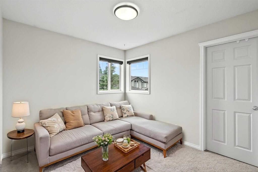 21-102 Canoe Square Sw, Airdrie, AB - Indoor Photo Showing Living Room