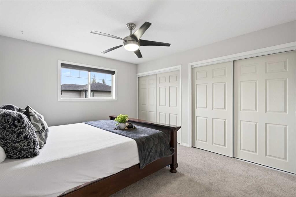 21-102 Canoe Square Sw, Airdrie, AB - Indoor Photo Showing Bedroom