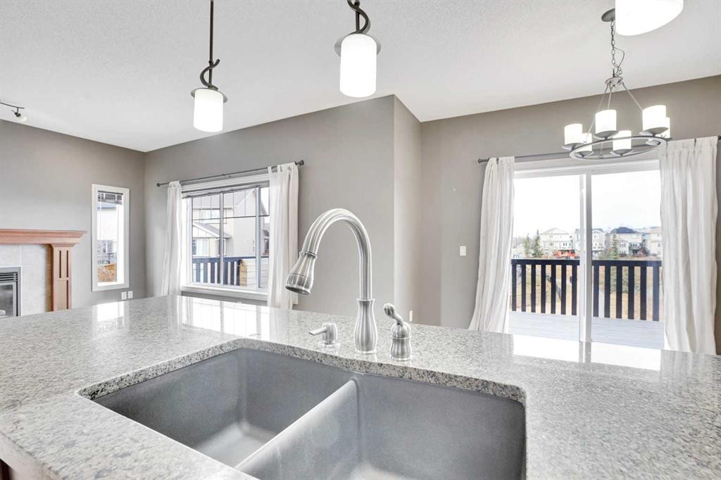208 Sagewood Landing Sw, Airdrie, AB - Indoor Photo Showing Kitchen With Double Sink With Upgraded Kitchen
