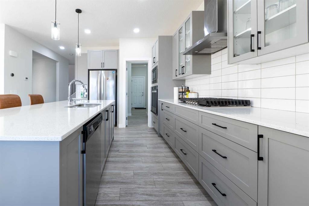 15 Midgrove Drive Sw, Airdrie, AB - Indoor Photo Showing Kitchen With Upgraded Kitchen