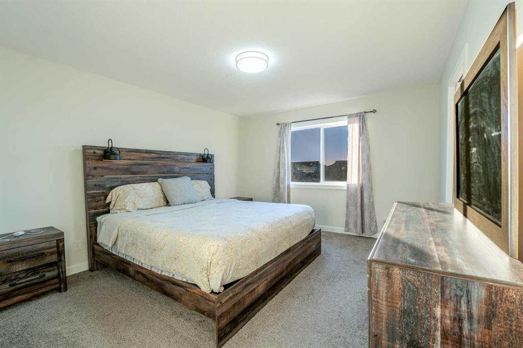 15 Midgrove Drive Sw, Airdrie, AB - Indoor Photo Showing Bedroom