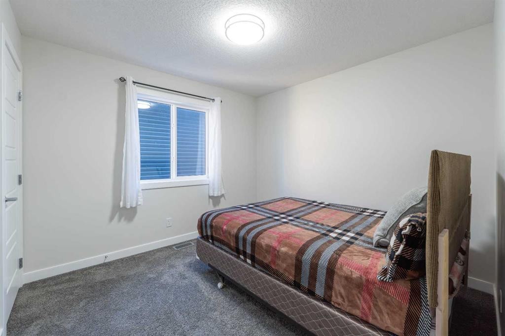 15 Midgrove Drive Sw, Airdrie, AB - Indoor Photo Showing Bedroom