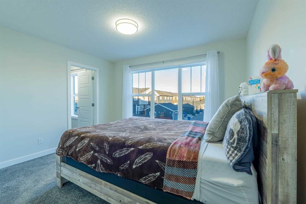 15 Midgrove Drive Sw, Airdrie, AB - Indoor Photo Showing Bedroom