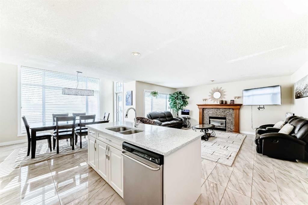 41 Covette Bay Ne, Calgary, AB - Indoor Photo Showing Other Room With Fireplace