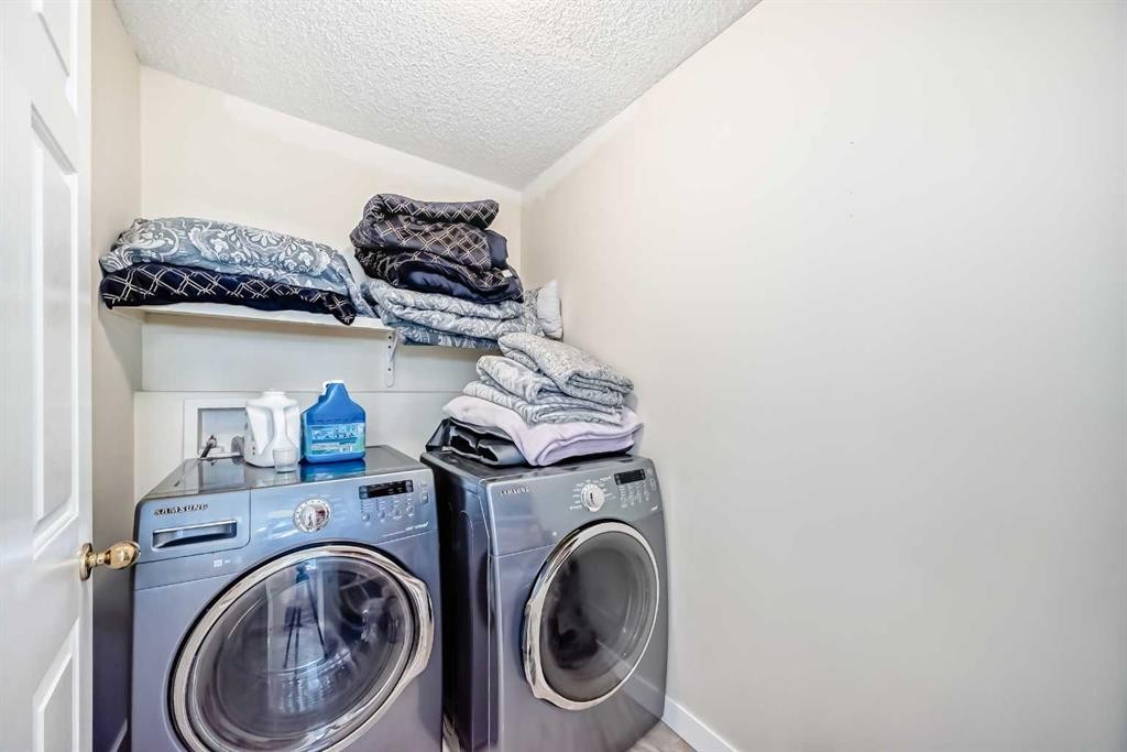 41 Covette Bay Ne, Calgary, AB - Indoor Photo Showing Laundry Room