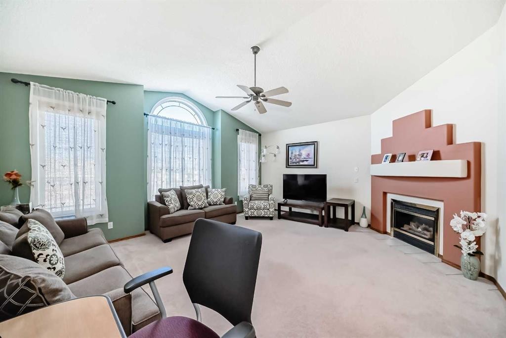 41 Covette Bay Ne, Calgary, AB - Indoor Photo Showing Living Room With Fireplace