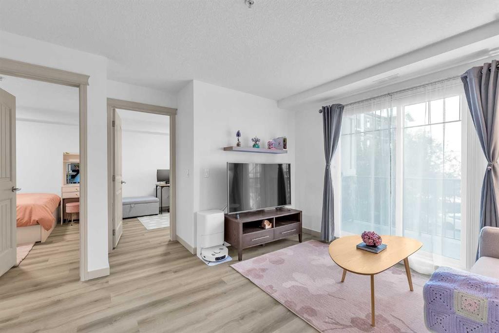 2214-175 Panatella Hill Nw, Calgary, AB - Indoor Photo Showing Living Room