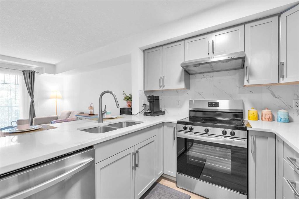 2214-175 Panatella Hill Nw, Calgary, AB - Indoor Photo Showing Kitchen With Double Sink