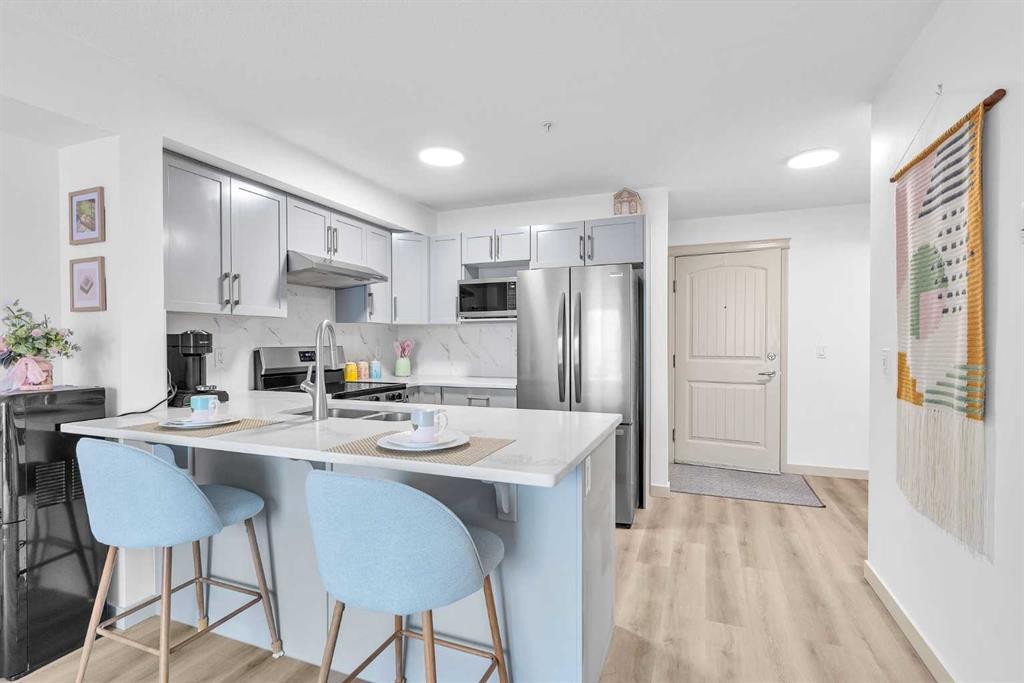 2214-175 Panatella Hill Nw, Calgary, AB - Indoor Photo Showing Kitchen With Stainless Steel Kitchen With Upgraded Kitchen