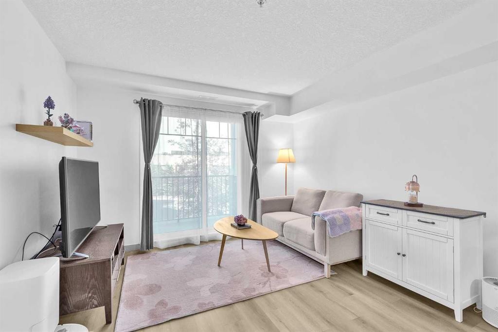 2214-175 Panatella Hill Nw, Calgary, AB - Indoor Photo Showing Living Room