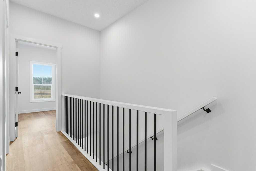 102-156 Park Street, Cochrane, AB - Indoor Photo Showing Other Room