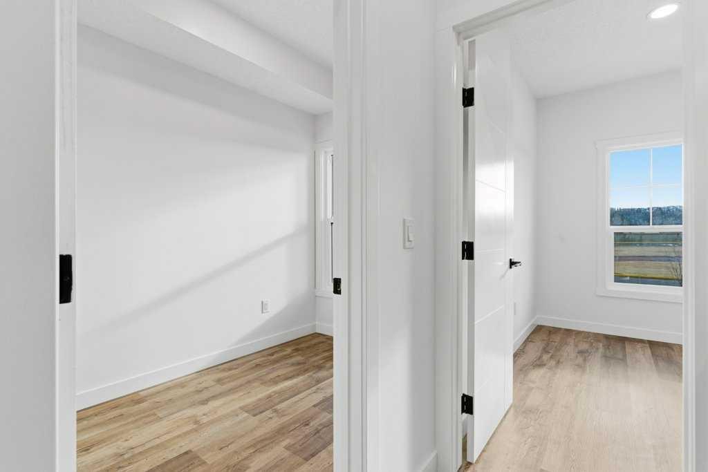 102-156 Park Street, Cochrane, AB - Indoor Photo Showing Other Room