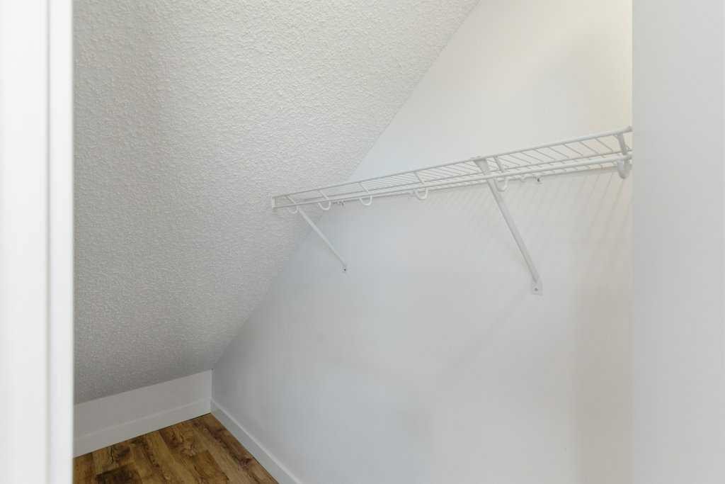 102-156 Park Street, Cochrane, AB - Indoor With Storage