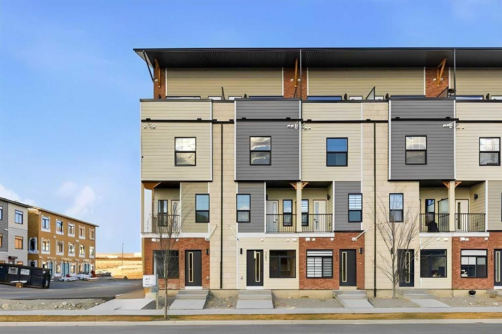 102-156 Park Street, Cochrane, AB - Outdoor With Balcony With Facade