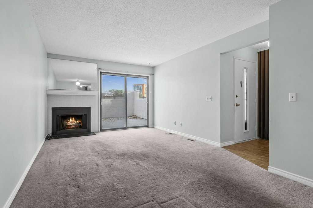 105-3500 Varsity Drive Nw, Calgary, AB - Indoor With Fireplace