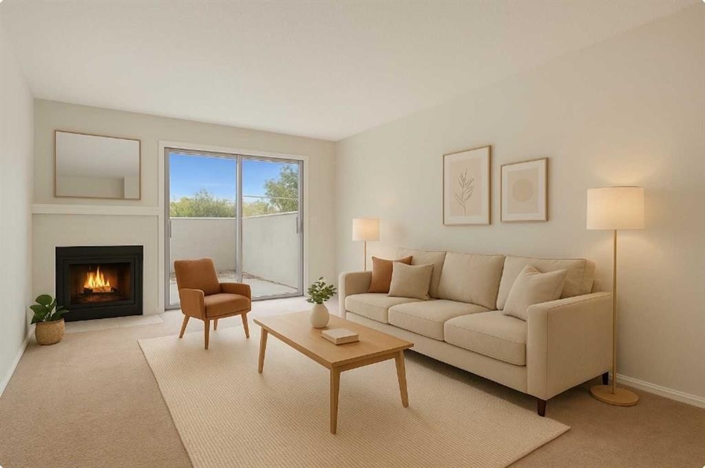 105-3500 Varsity Drive Nw, Calgary, AB - Indoor Photo Showing Living Room With Fireplace
