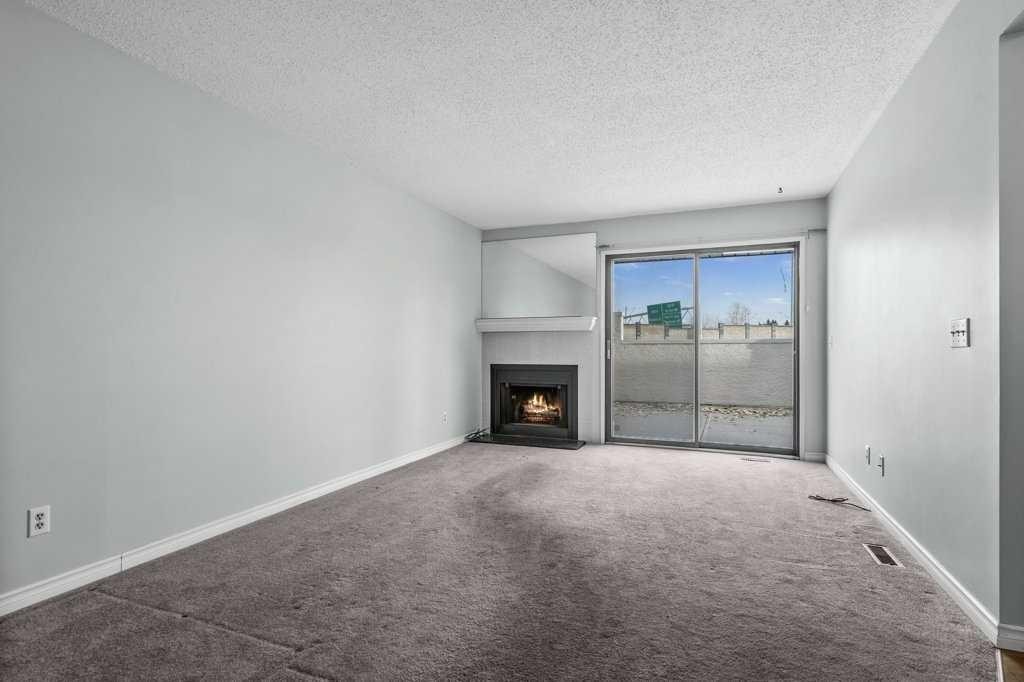 105-3500 Varsity Drive Nw, Calgary, AB - Indoor With Fireplace