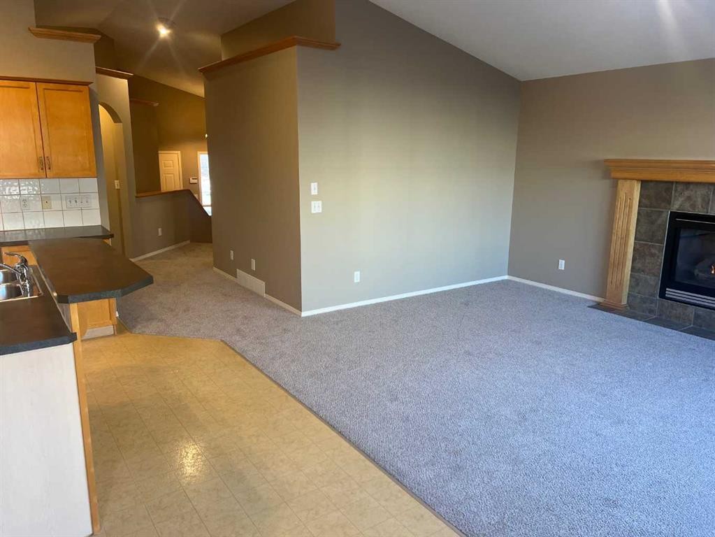 40 Bridlewood Gardens Sw, Calgary, AB - Indoor With Fireplace