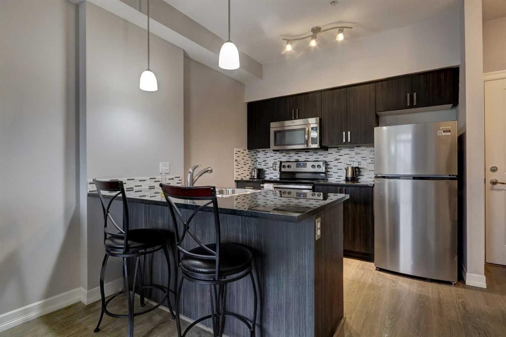 324-117 Copperpond Common Se, Calgary, AB - Indoor Photo Showing Kitchen With Stainless Steel Kitchen