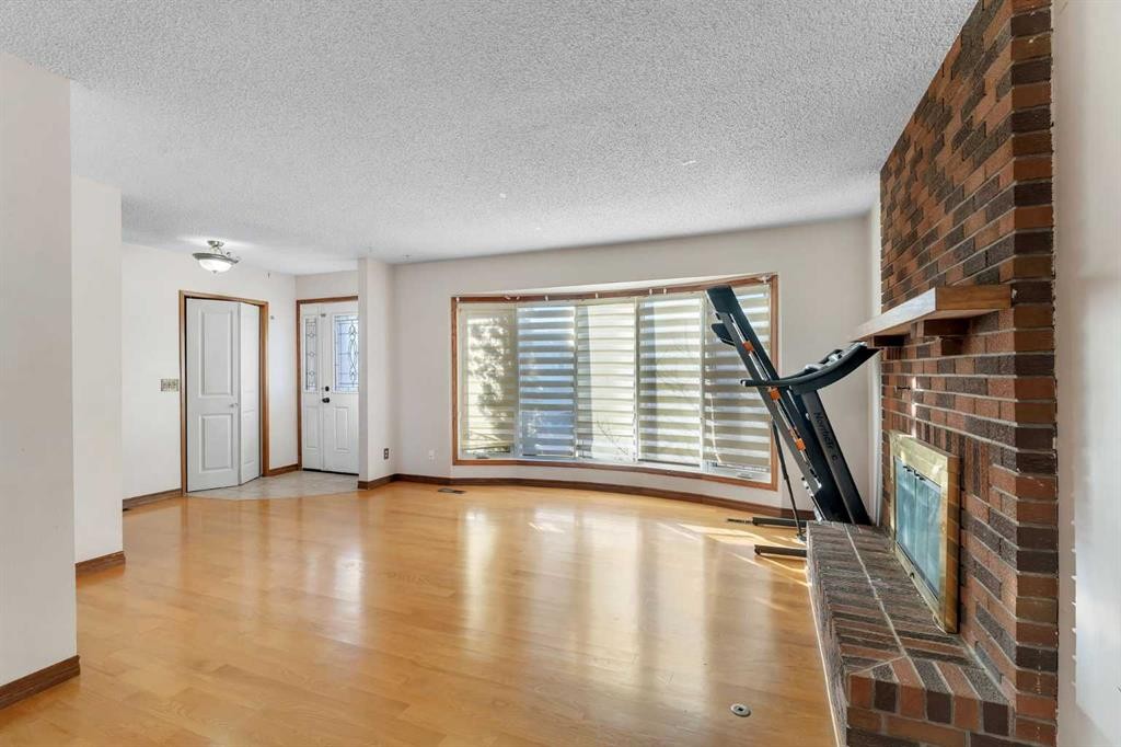 20 Templehill Crescent Ne, Calgary, AB - Indoor Photo Showing Other Room With Fireplace