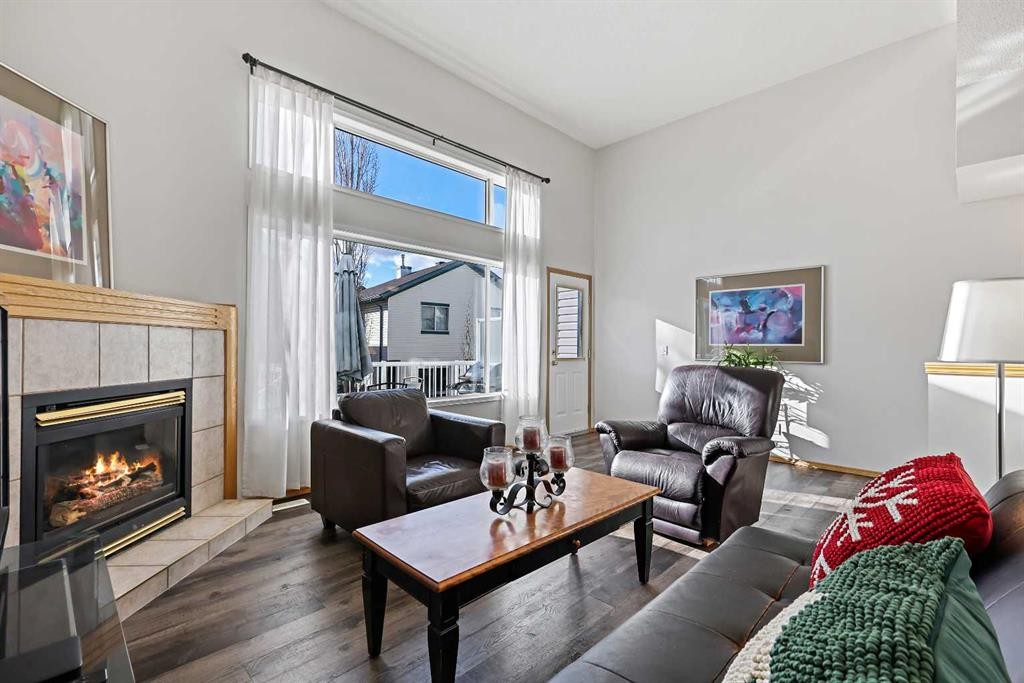 258 Rocky Ridge Court Nw, Calgary, AB - Indoor Photo Showing Living Room With Fireplace