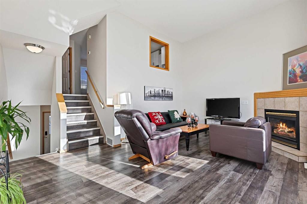 258 Rocky Ridge Court Nw, Calgary, AB - Indoor Photo Showing Living Room With Fireplace