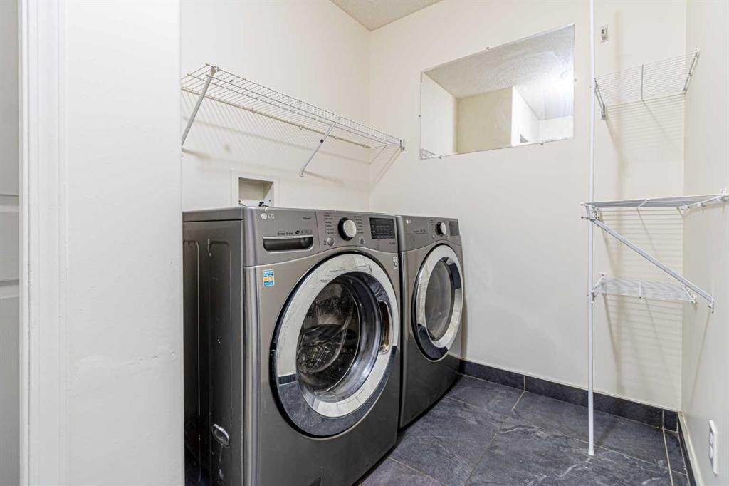 49 Welshimer Crescent Ne, Langdon, AB - Indoor Photo Showing Laundry Room