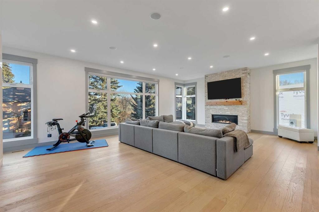30 Roselawn Crescent Nw, Calgary, AB - Indoor Photo Showing Living Room With Fireplace