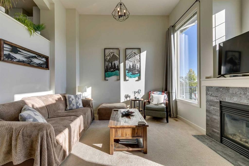44 Everridge Common Sw, Calgary, AB - Indoor Photo Showing Living Room With Fireplace