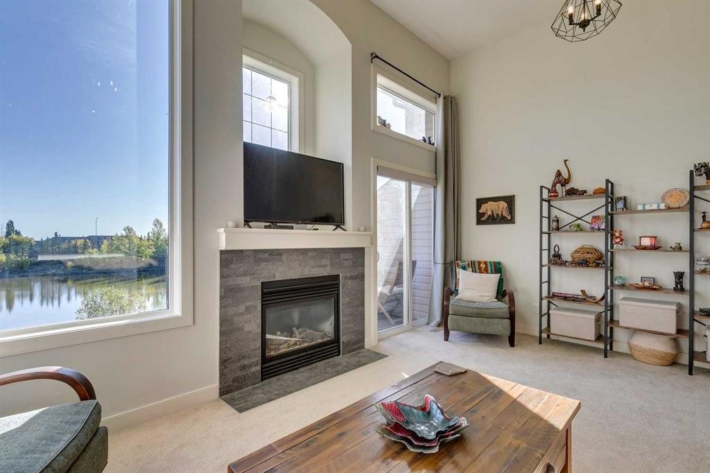 44 Everridge Common Sw, Calgary, AB - Indoor Photo Showing Living Room With Fireplace