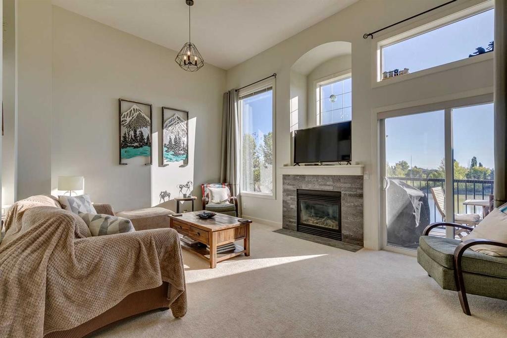 44 Everridge Common Sw, Calgary, AB - Indoor Photo Showing Living Room With Fireplace