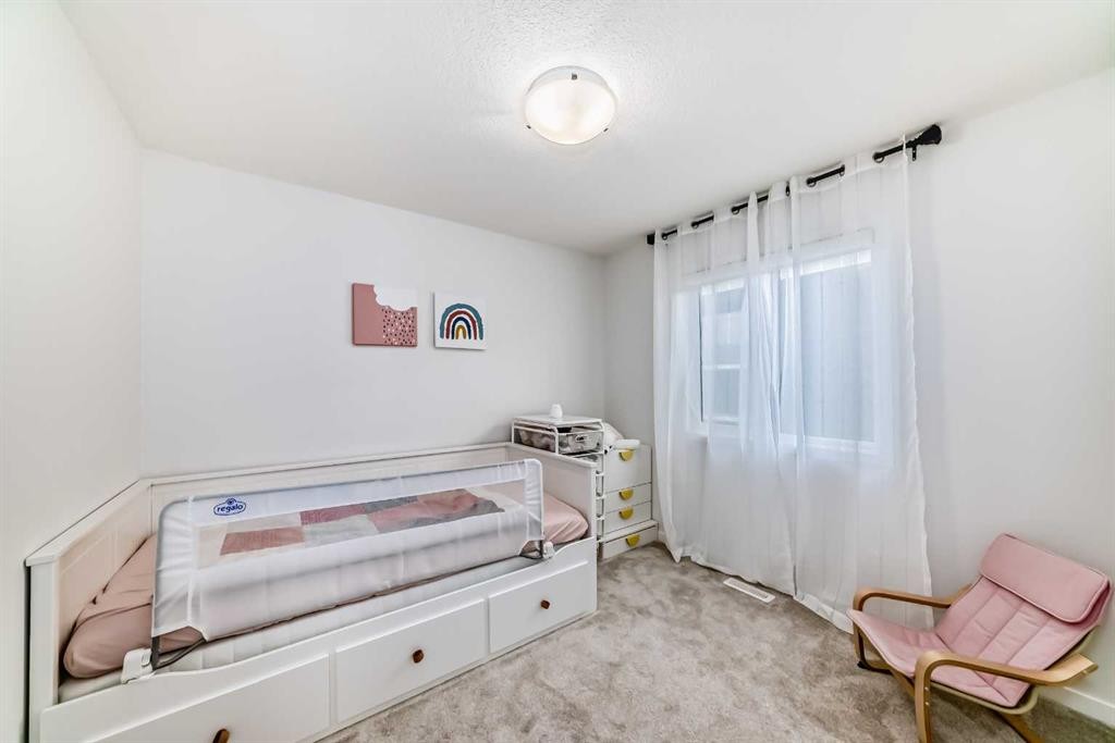 12 West Grove Link Sw, Calgary, AB - Indoor Photo Showing Bedroom