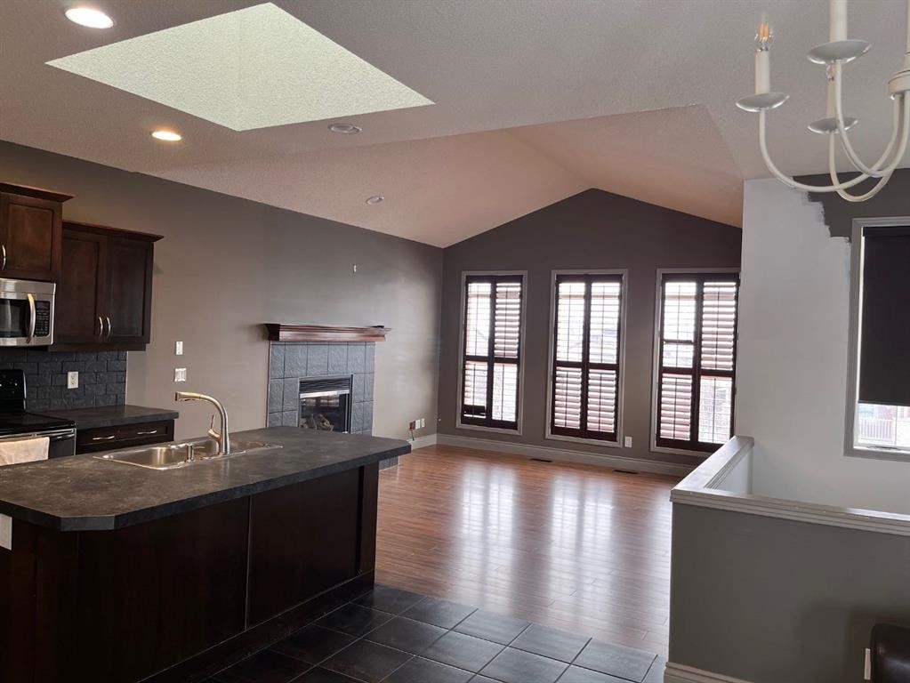 79 Prestwick Street Se, Calgary, AB - Indoor Photo Showing Kitchen With Fireplace