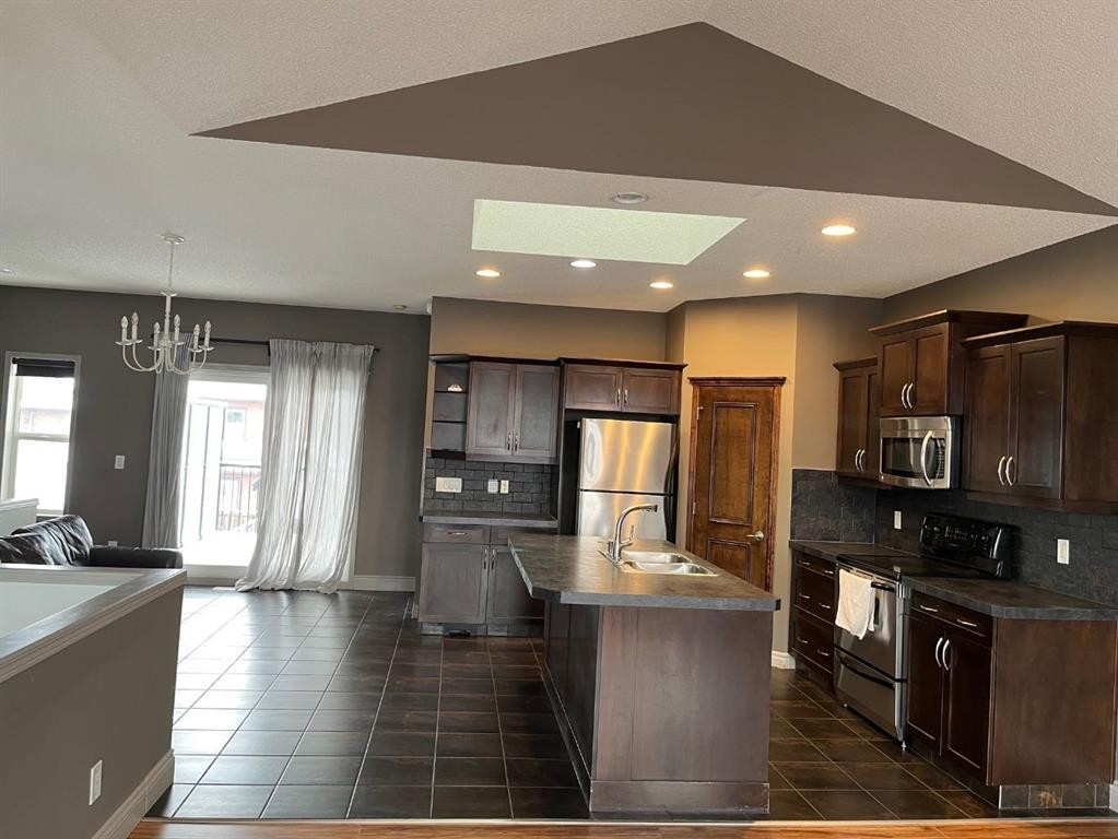 79 Prestwick Street Se, Calgary, AB - Indoor Photo Showing Kitchen With Double Sink