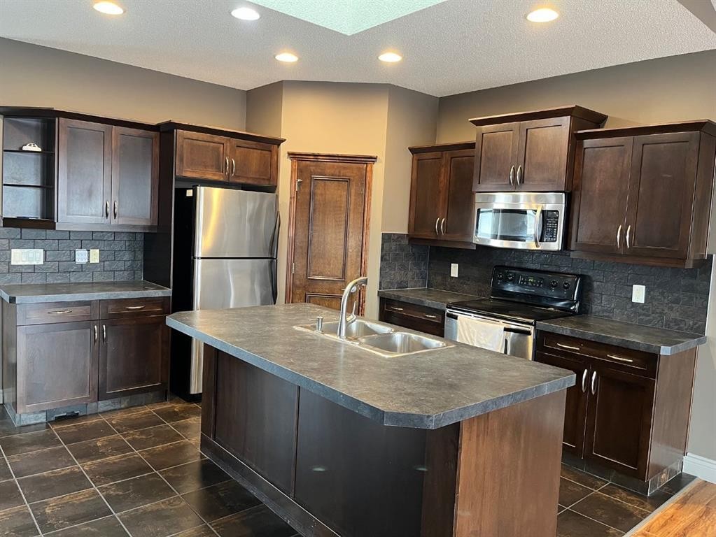 79 Prestwick Street Se, Calgary, AB - Indoor Photo Showing Kitchen With Double Sink