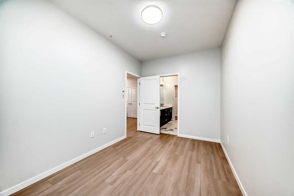 404-80 Carrington Plaza Nw, Calgary, AB - Indoor Photo Showing Other Room