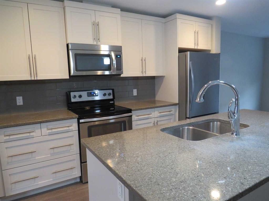 309 Evansridge Park Nw, Calgary, AB - Indoor Photo Showing Kitchen With Stainless Steel Kitchen With Double Sink With Upgraded Kitchen
