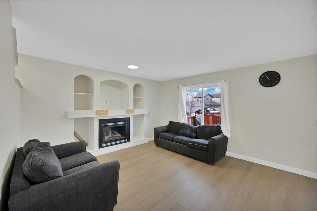 5934 Saddlehorn Drive Ne, Calgary, AB - Indoor Photo Showing Living Room With Fireplace