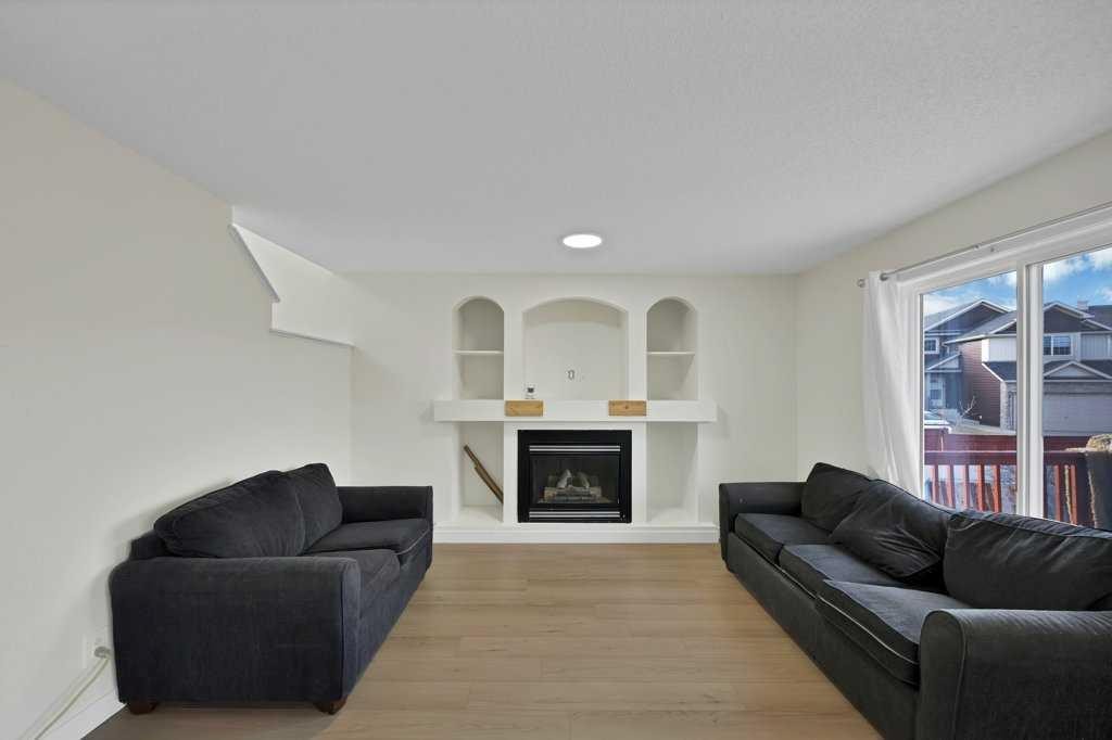5934 Saddlehorn Drive Ne, Calgary, AB - Indoor Photo Showing Living Room With Fireplace