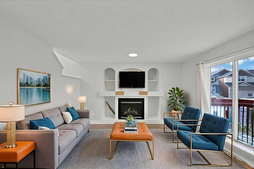 5934 Saddlehorn Drive Ne, Calgary, AB - Indoor Photo Showing Living Room With Fireplace