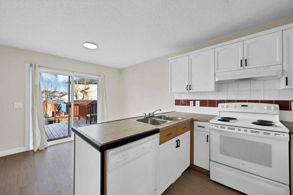 5934 Saddlehorn Drive Ne, Calgary, AB - Indoor Photo Showing Kitchen With Double Sink