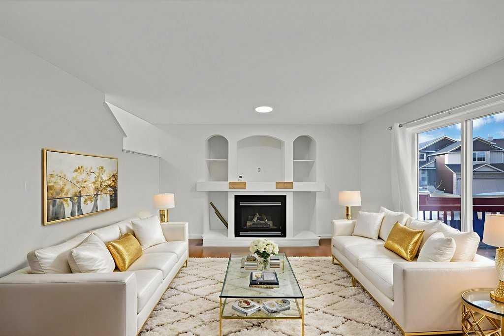 5934 Saddlehorn Drive Ne, Calgary, AB - Indoor Photo Showing Living Room With Fireplace