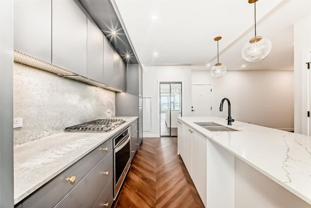 410-8505 Broadcast Avenue Sw, Calgary, AB - Indoor Photo Showing Kitchen With Double Sink With Upgraded Kitchen
