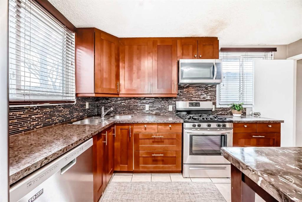 3042 31A Street Se, Calgary, AB - Indoor Photo Showing Kitchen With Double Sink