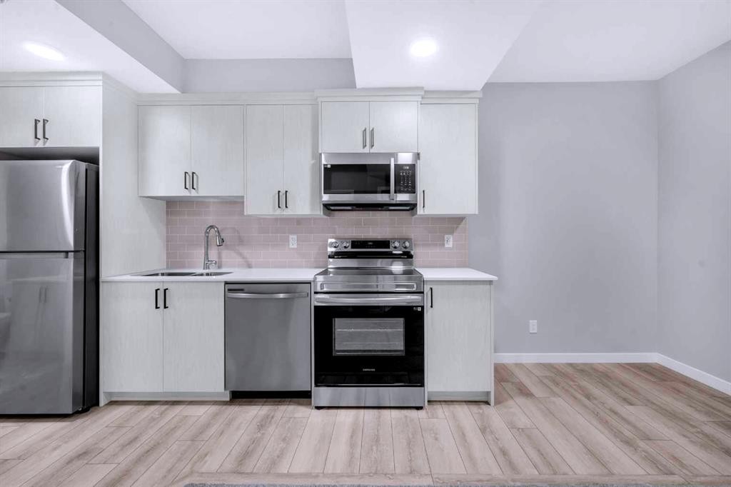 154 Silver Spruce Grove Sw, Calgary, AB - Indoor Photo Showing Kitchen With Stainless Steel Kitchen