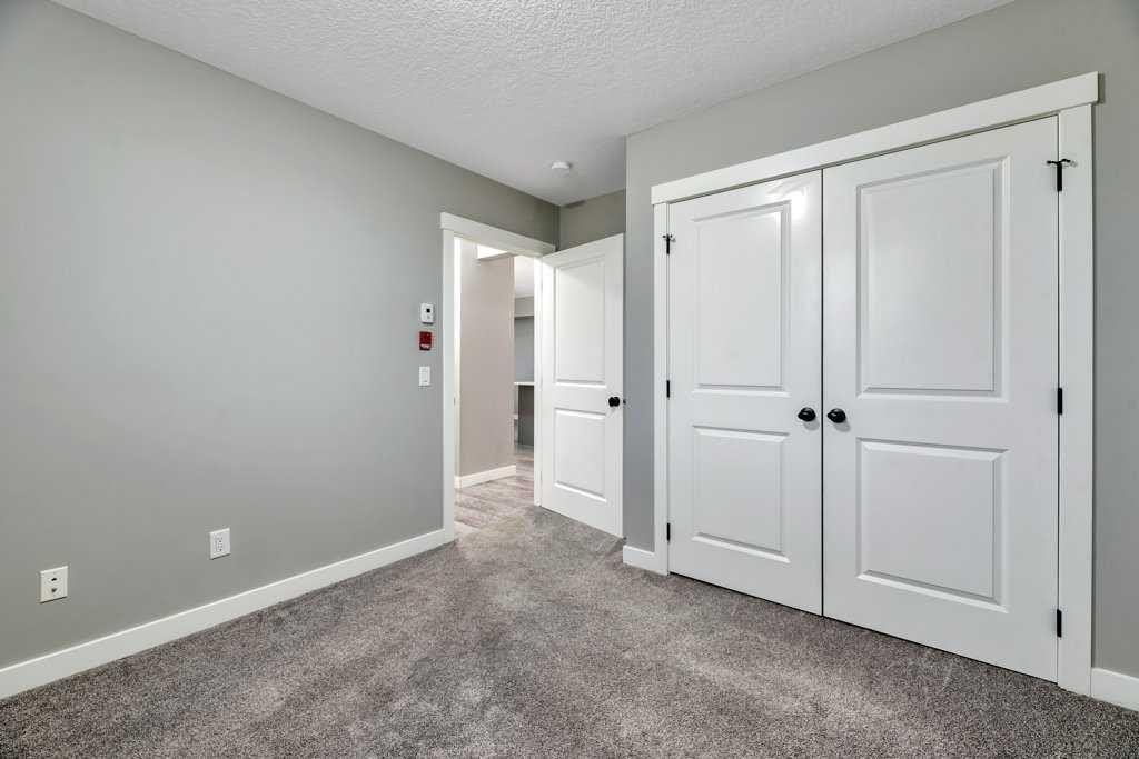 12-606 Lakeside Boulevard, Strathmore, AB - Indoor Photo Showing Other Room