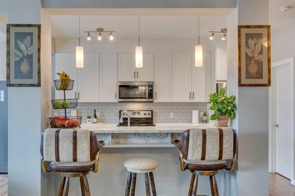 228 Sage Bluff Drive Nw, Calgary, AB - Indoor Photo Showing Kitchen With Upgraded Kitchen