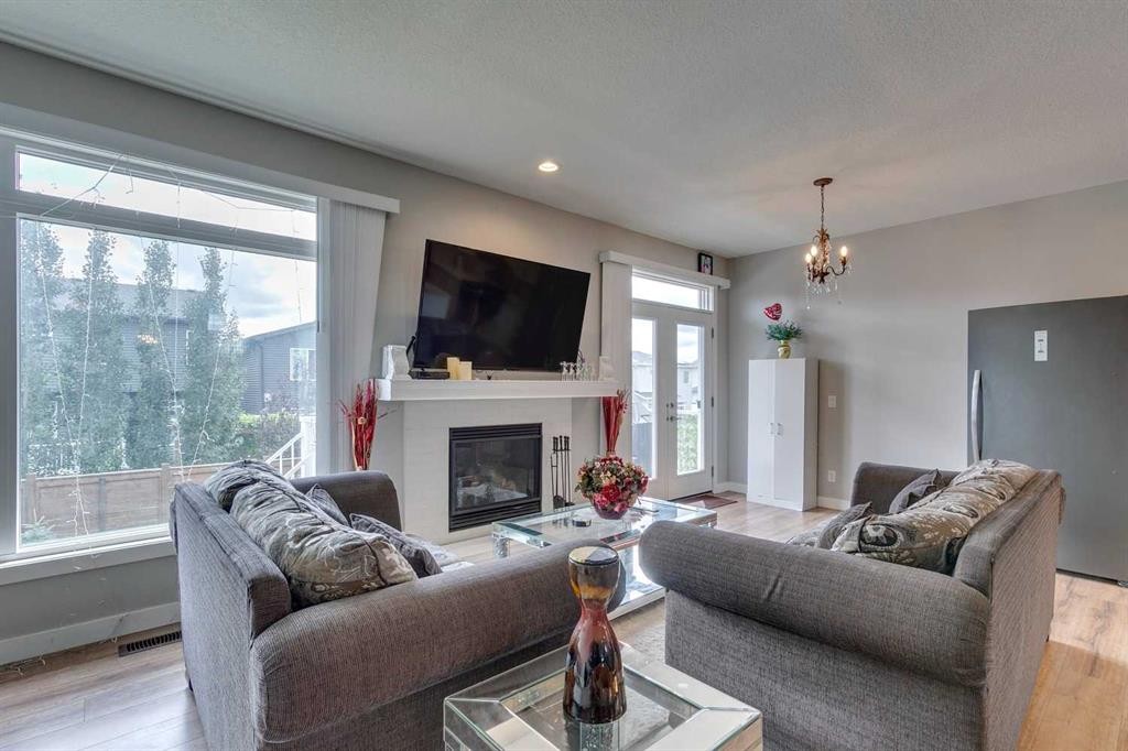 228 Sage Bluff Drive Nw, Calgary, AB - Indoor Photo Showing Living Room With Fireplace