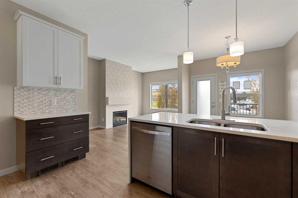 81 Copperpond Landing Se, Calgary, AB - Indoor Photo Showing Kitchen With Double Sink